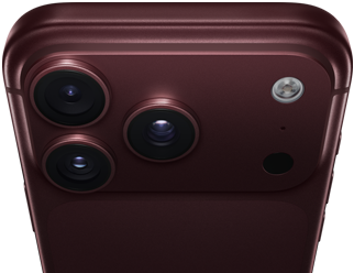 Un iPhone 18 Pro Max, couleur bourgogne (rouge foncé), face arrière, système caméra Pro Fusion dans la partie supérieure, 3 objectifs, lames d’ouverture variable partiellement fermées, flash, microphone et scanneur LiDAR, dessus, antenne cellulaire, côtés plats, bords arrondis