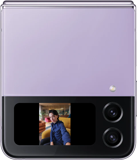The Front Cover of a Galaxy Z Flip4 on its side with a person taking a selfie shown in the vertical Cover
				Screen. The phone is rotated and the photo rotates accordingly and shows its original aspect ratio on the now
				horizontal Cover Screen.